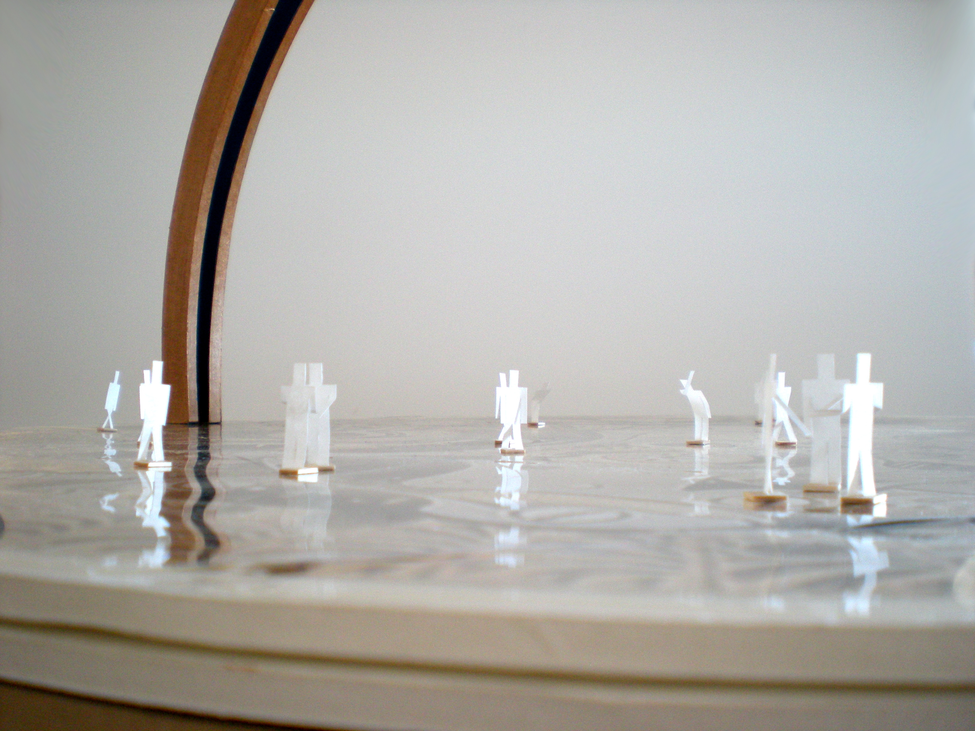 a close-up of the model taken at ground-level, showing the paper people walking around on the plaza